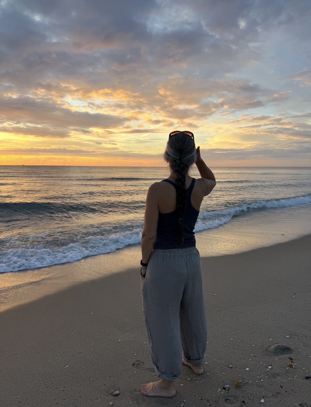 Robyn watching the sunrise over the ocean